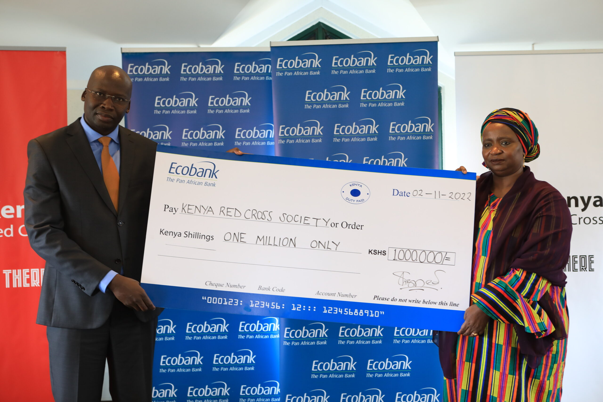 Ecobank Kenya Limited Executive Director Samuel Odhiambo hands over the Bank's donation towards the famine appeal to Keny Red Cross Society Secretary General, Dr. Asha Mohammed